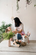 © Natalia - little girl helps mom florist to collect a bouquet of flowers at the table