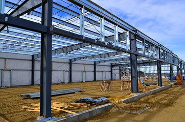 Wall Mural - Steel frame commercial building under construction for expanding local business in urban area.