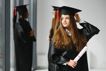 Woman portrait on her graduation day. University. Education, graduation and people concept.