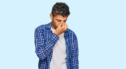 Poster - Young handsome african american man wearing casual clothes tired rubbing nose and eyes feeling fatigue and headache. stress and frustration concept.