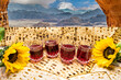 Digitally manipulated concept - Jewish Passover Holiday (Pesah). Matzoh, glasses with red wine, flowers and patterns of stone desert are symbols of Jewish  Exodus heritage