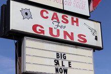 Indianapolis - Circa March 2021: Cash For Guns Sign At A Gun Shop. In Hard Economic Times, People Sell, Pawn Or Consign Guns And Weapons For Quick Cash.