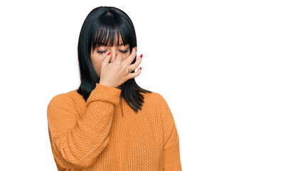 Sticker - Young hispanic woman wearing casual clothes tired rubbing nose and eyes feeling fatigue and headache. stress and frustration concept.