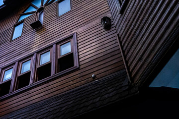 Poster - Low angle shot of an old building with a brown facade