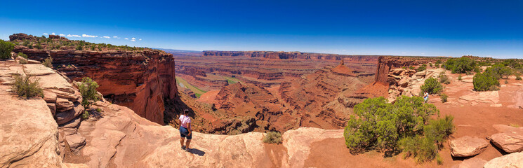 Canvas Print - Female tourist enjoy a wonderful view of Dead Horse Point State Park, Utah