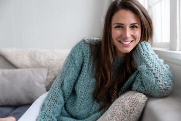beautiful lifestyle portrait of a happy female brunette with perfect white teeth, smiling cheerfully