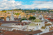 Aerial cityscape of the historic city center of Quito with the Compania de Jesus church dome, Ecuador.