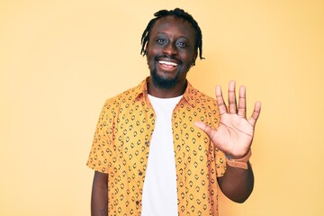 Canvas Print - Young african american man with braids wearing casual clothes showing and pointing up with fingers number five while smiling confident and happy.