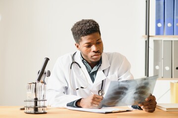 Portrait of doctor checking on X-ray results