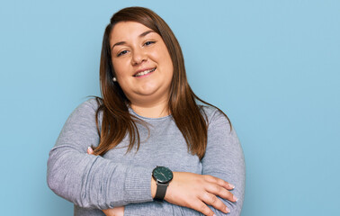 Wall Mural - Beautiful brunette plus size woman wearing casual clothes happy face smiling with crossed arms looking at the camera. positive person.