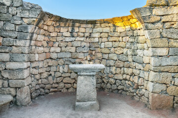 Stone wall with an altar in the archaeological museum of Chersonese  - national historical and archaeological reserve.