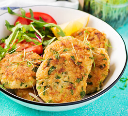 Wall Mural - Homemade fish croquette with white fish, bulgur, spinach and breadcrumbs. Fritters from minced cod. Delicious and nutritious lunch or dinner.