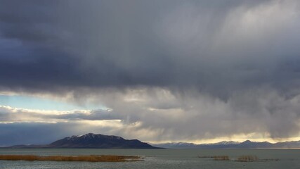 Wall Mural - Storm clouds rolling through the sky over Utah Lake looking towards West Mountain.