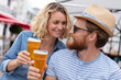 © auremar - young and happy couple with beer outdoors