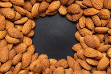 Brown almond seed background with copy space.