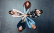 © Jacob Lund - Students with hands stacked together