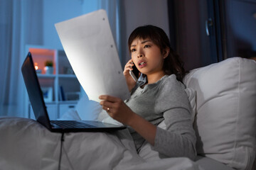 Sticker - woman with laptop calling on phone in bed at night