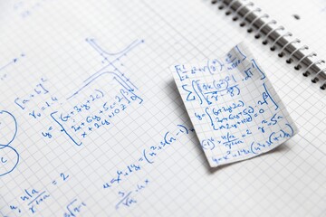 Math exercise in notebook closeup