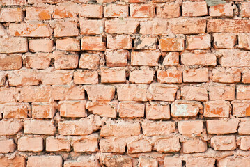 Texture of brick wall. Samples of wall or fence are presented at exhibitions. Orange brick close up.