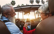 © Alessandro Biascioli - Happy senior couple having fun driving on new convertible car - Mature people enjoying time together during road trip tour vacation - Elderly lifestyle and travel culture transportation concept