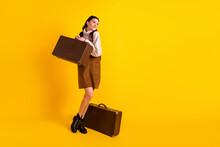 Full Length Body Size View Of Attractive Cheerful Dreamy Girl Carrying Bag Tourism Isolated Over Bright Yellow Color Background