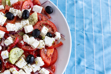 Wall Mural - Greek salad, typical greek food with feta cheese