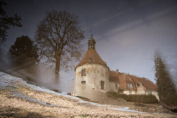 Wall Mural - Reflection of medieval castle with a large tower in Jaunpils, Latvia