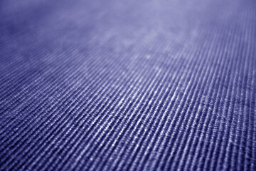 Wall Mural - Blue color textile pattern close-up with blur effect.