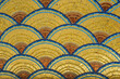 Golden fish scale like mosaic pattern in Art Nouveau style on a building