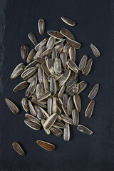 Sticker - a pile of fresh roasted striped sunflower seeds