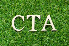 Alphabet Letter In Word CTA (Abbreviation Of Call To Action Or Chartered Tax Adviser) On Green Grass Background