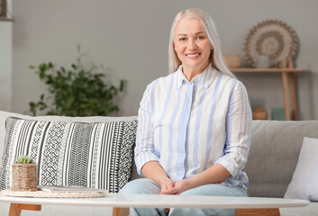 Canvas Print - Portrait of smiling mature woman at home