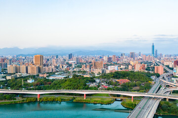 Poster - Taipei City Aerial View - Asia business concept image, panoramic modern cityscape building bird’s eye view under sunrise and morning blue bright sky, shot in Taipei, Taiwan