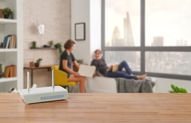 Wall Mural - Modem and router box on the table and living room background blur concept.