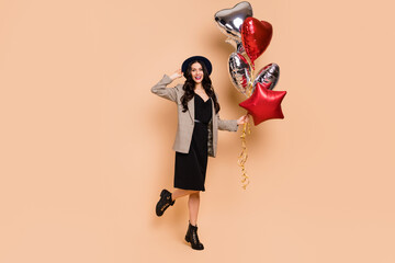 Sticker - Photo of sweet charming young lady dressed checkered blazer arm cap holding balloons isolated beige color background