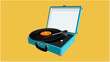 Portable record player with light blue suitcase on yellow background