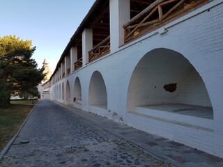 White stone walls and towers of an ancient fortress