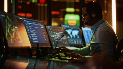 Aufkleber - Professional IT Technical Support Specialist and Software Developer Working on Computer in Monitoring Control Room with Digital Screens. Employee Puts on Headphones with Mic and Talking on a Call.
