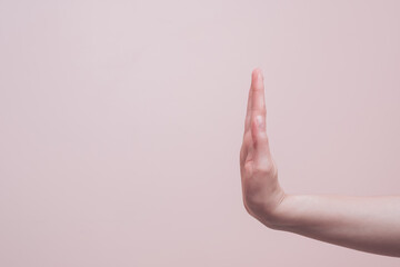 Wall Mural - Female hand showing stop and no sign gesture, copy space