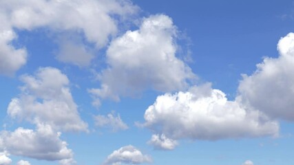 Wall Mural - View on moving clouds in blue sky.