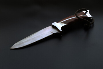 Poster - The knife on a black background