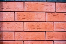Fragment Of Red Brickwork. Part Of A Brown Brick Wall