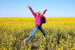 © Оксана  - Girl jumping on the background of the field