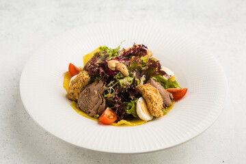 Wall Mural - fresh salad of leaves, veal and tomatoes