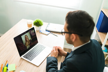 HR manager doing an online interview with a female applicant