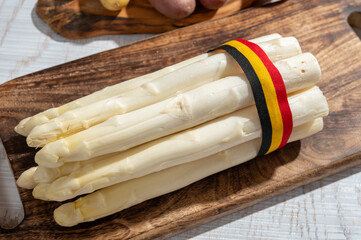 Wall Mural - New harvest of high quality Belgian white asparagus washed, uncooked, tasty vegetarian dinner