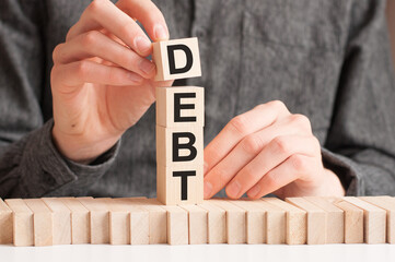 the word of debt on building blocks concept