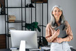 © Kateryna - Portrait of a confident beautiful smart gray-haired asian business woman or manager, standing in modern office, dressed in stylish clothes, holding folder in hands, looking at camera, smiling friendly