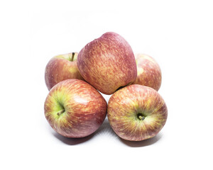 Closeup of a group of ripe red apples isolated on white background