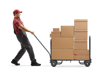 Worker pulling a hand truck loaded with cardboard boxes